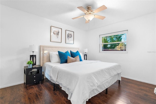 bedroom featuring ceiling fan and dark hardwood / wood-style floors