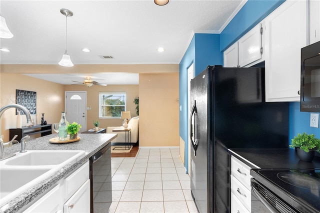 kitchen featuring light tile patterned flooring, white cabinetry, black dishwasher, sink, and hanging light fixtures