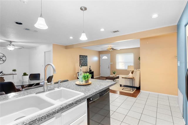 kitchen with decorative light fixtures, white cabinetry, black dishwasher, sink, and light tile patterned floors