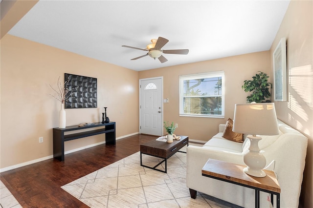 living room featuring ceiling fan and wood-type flooring