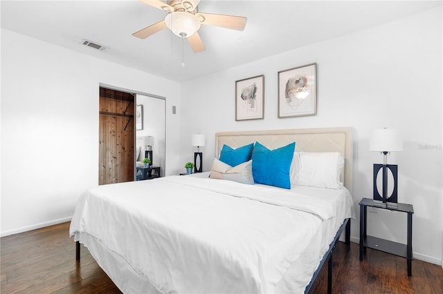 bedroom with dark wood-type flooring and ceiling fan