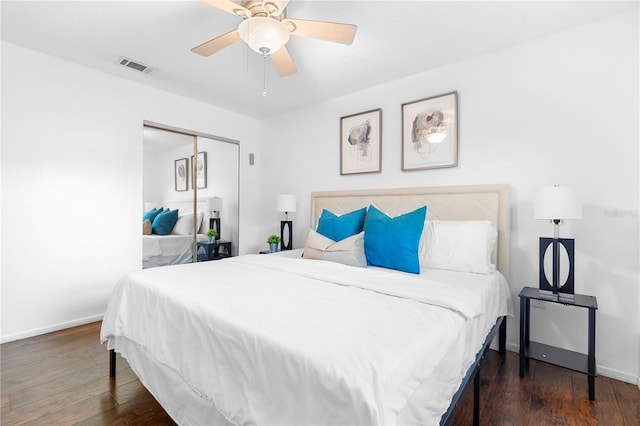 bedroom featuring dark hardwood / wood-style flooring, a closet, and ceiling fan