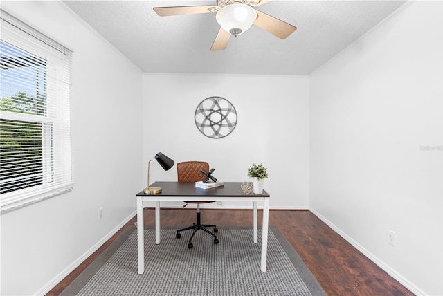 office space with dark wood-type flooring, ceiling fan, and a textured ceiling