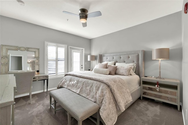 bedroom with ceiling fan and dark carpet