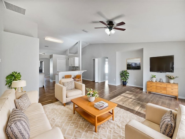 living room featuring ceiling fan, light wood-type flooring, and lofted ceiling