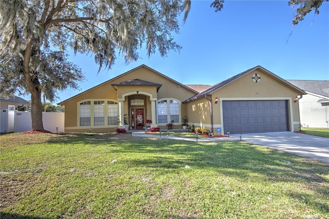 single story home with a garage and a front lawn