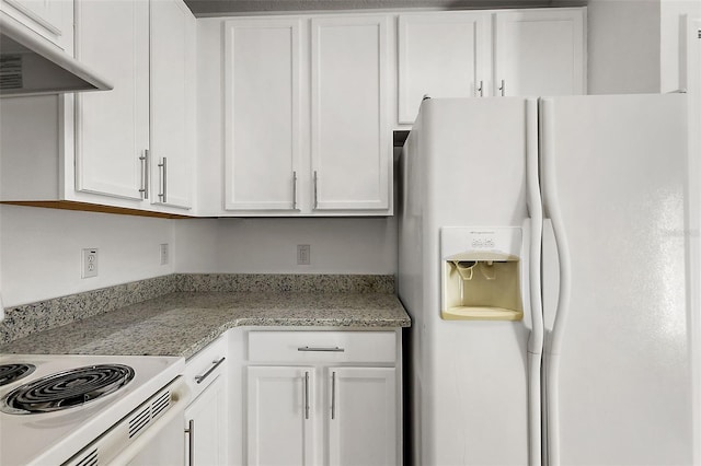 kitchen with white cabinets, light stone countertops, and white appliances