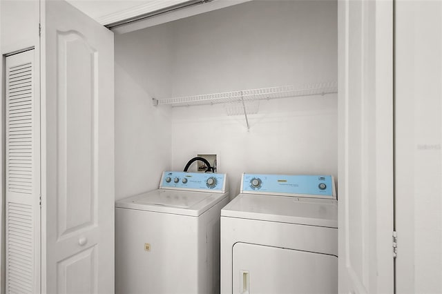 washroom with washing machine and dryer