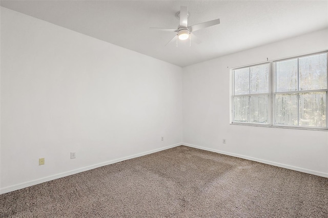 empty room with carpet flooring and ceiling fan