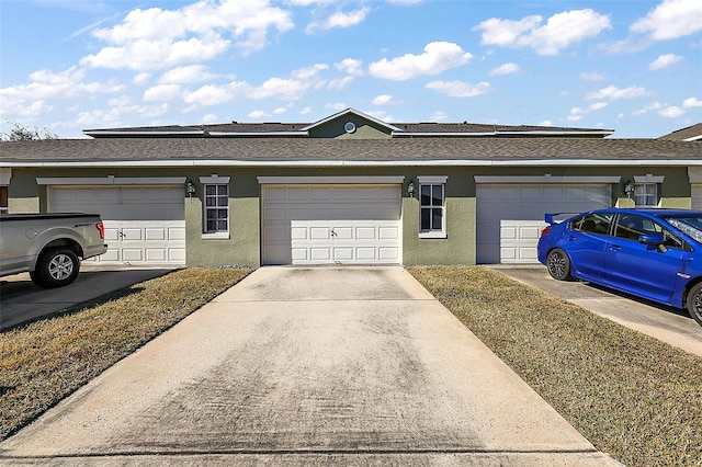 ranch-style home with a garage