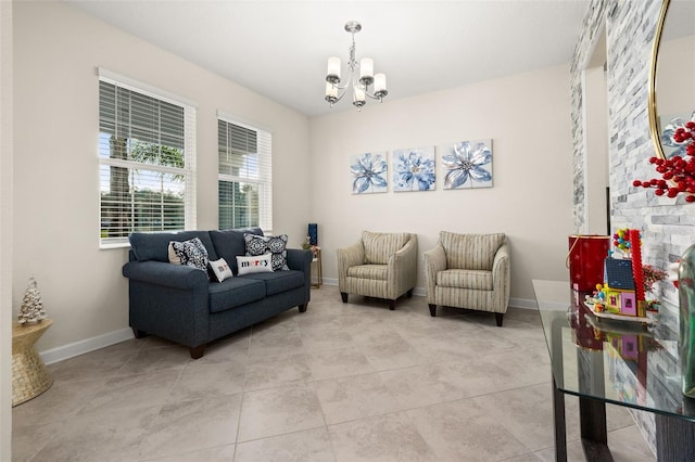 tiled living room with a notable chandelier