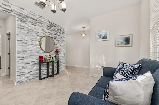 tiled living room with an inviting chandelier