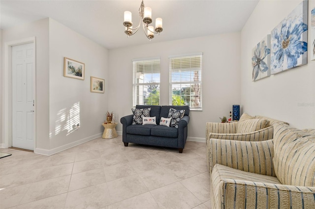 living room with a chandelier and light tile patterned floors