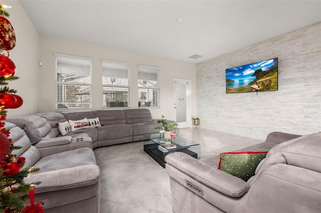 tiled living room with a healthy amount of sunlight