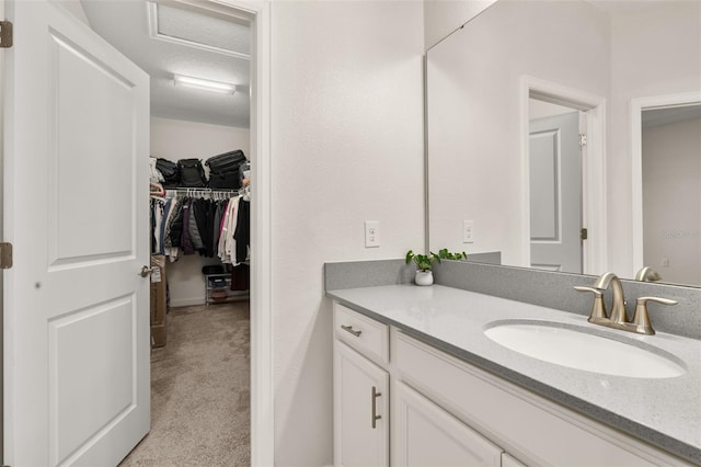 bathroom with vanity and a textured ceiling