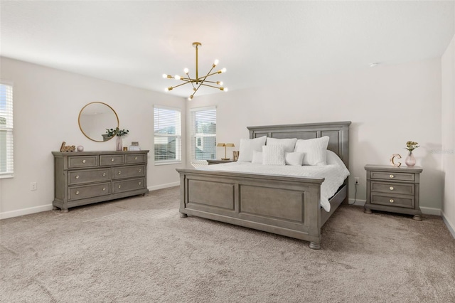 carpeted bedroom with an inviting chandelier