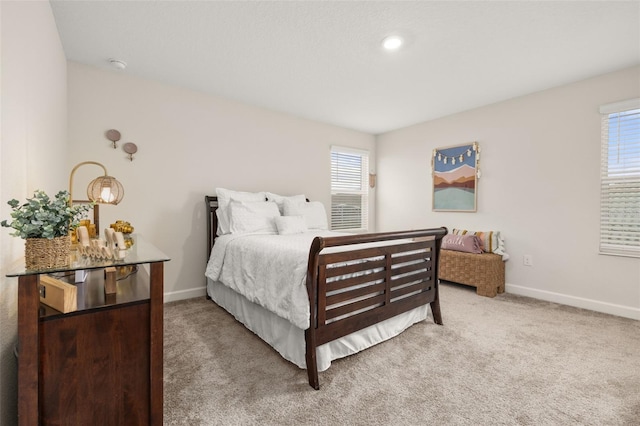 bedroom with light colored carpet