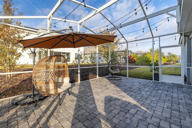 view of patio / terrace with a lanai