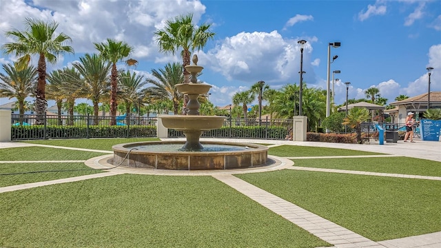 view of property's community featuring a yard