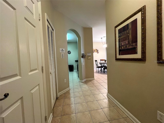 hallway with light tile patterned floors