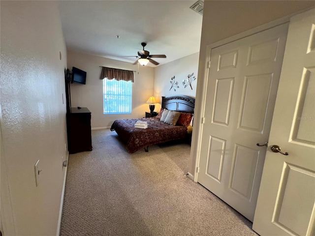 carpeted bedroom with ceiling fan