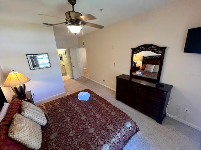 carpeted bedroom featuring ensuite bathroom and ceiling fan