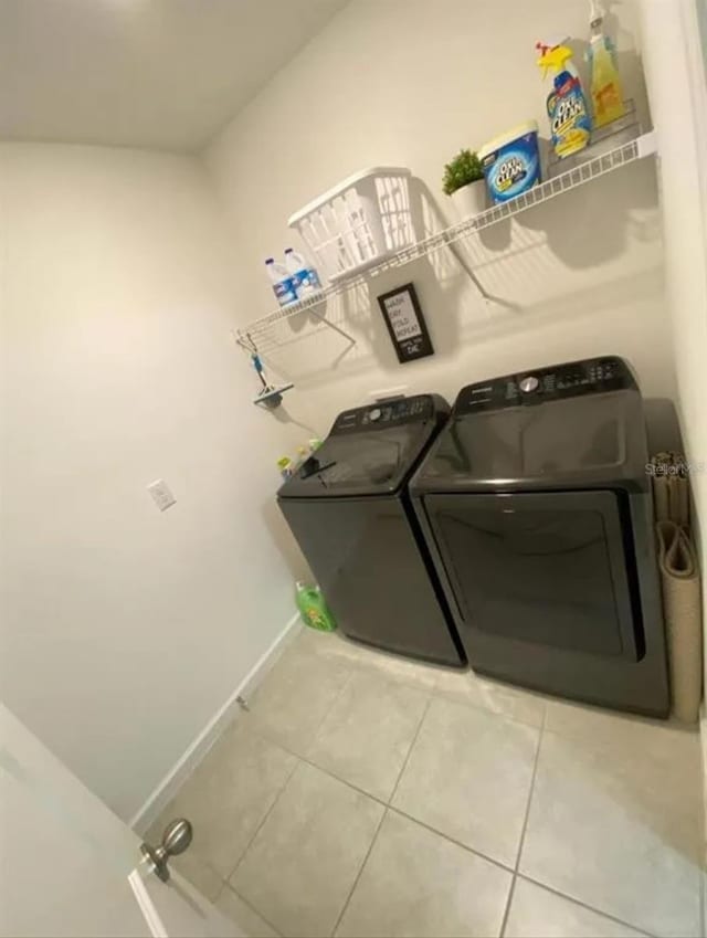 laundry area featuring tile patterned floors and independent washer and dryer