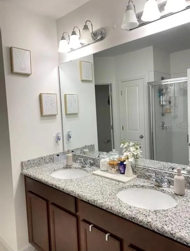 bathroom with vanity and an enclosed shower