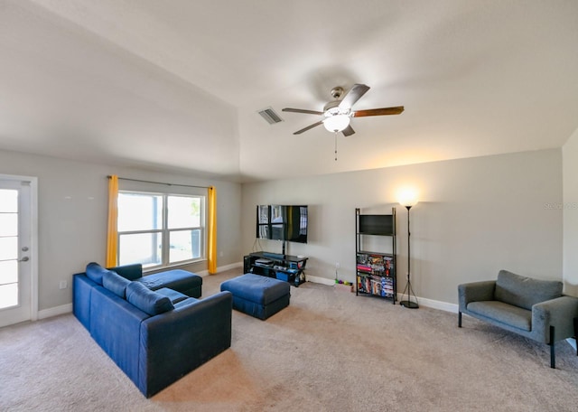 carpeted living room featuring ceiling fan and lofted ceiling