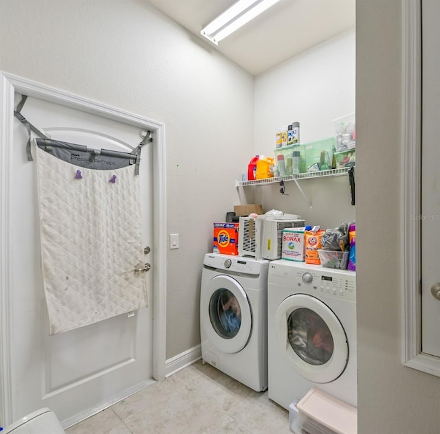 laundry room featuring washer and clothes dryer