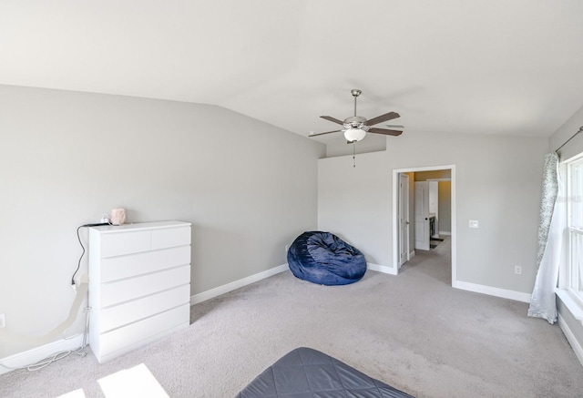 bedroom featuring ceiling fan, light carpet, and vaulted ceiling