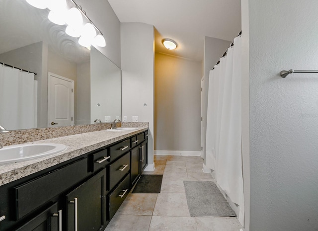 14308 Edinburgh Moor Dr, Wimauma, FL 33598 - full bath featuring double vanity, tile patterned flooring, and a shower with curtain