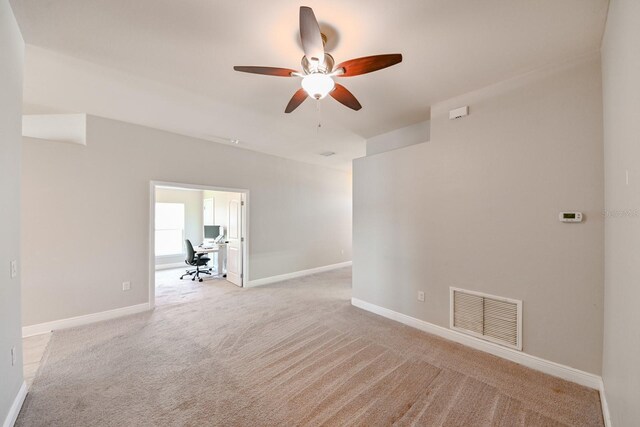 14308 Edinburgh Moor Dr, Wimauma, FL 33598 - unfurnished room featuring ceiling fan, light carpet, and an office area