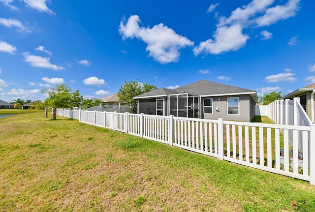 14308 Edinburgh Moor Dr, Wimauma, FL 33598 - fenced backyard with a sunroom