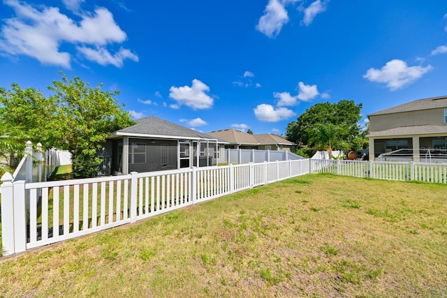 view of yard with a sunroom