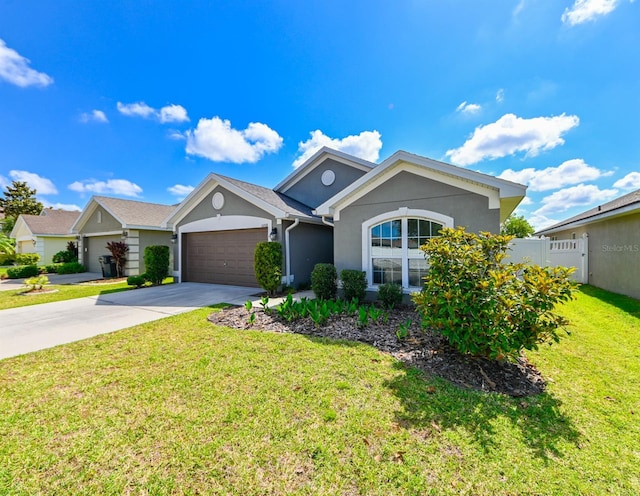 14308 Edinburgh Moor Dr, Wimauma, FL 33598 - single story home featuring an attached garage, stucco siding, and driveway