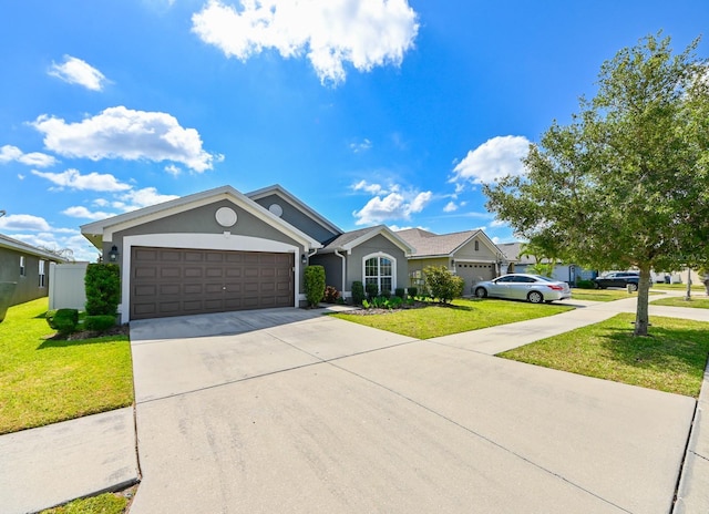 single story home featuring a garage and a front lawn