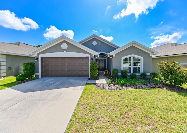 single story home featuring a garage and a front yard