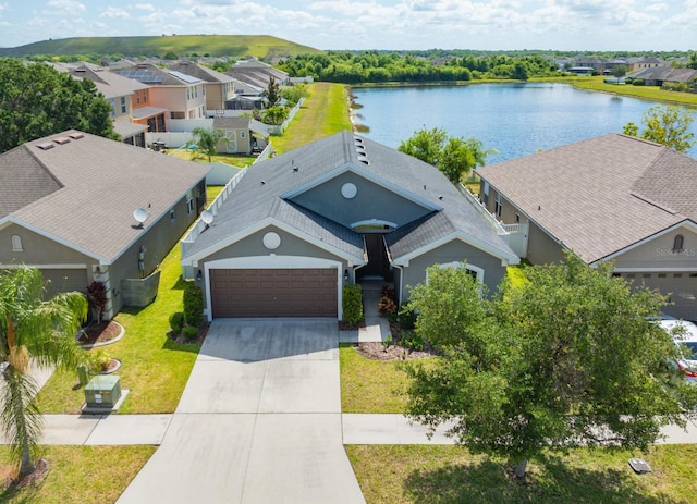 drone / aerial view with a water view