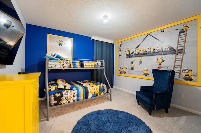 carpeted bedroom featuring a textured ceiling