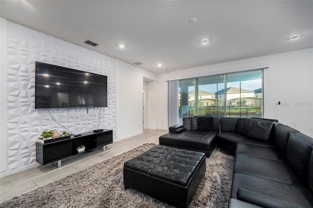 living room with a textured ceiling