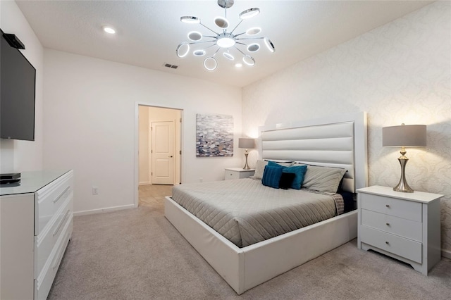 bedroom with light carpet and a chandelier