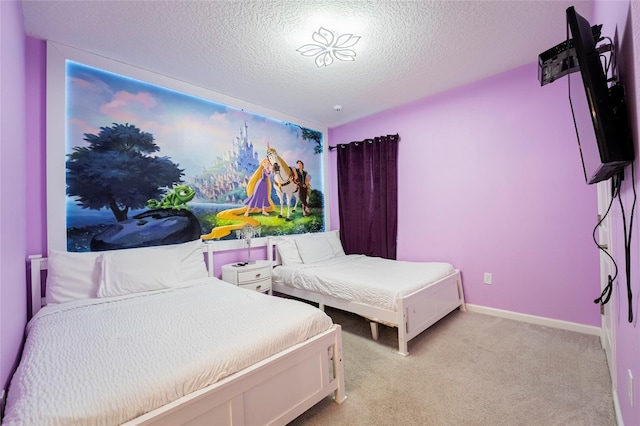 bedroom featuring light colored carpet and a textured ceiling