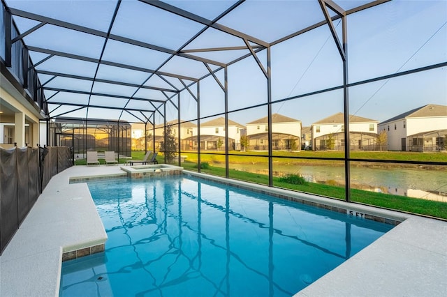 view of pool with a lanai, an in ground hot tub, and a patio