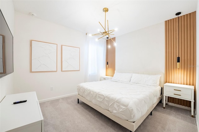 bedroom featuring light carpet and a chandelier