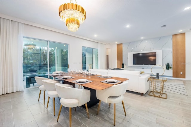 dining space featuring an inviting chandelier