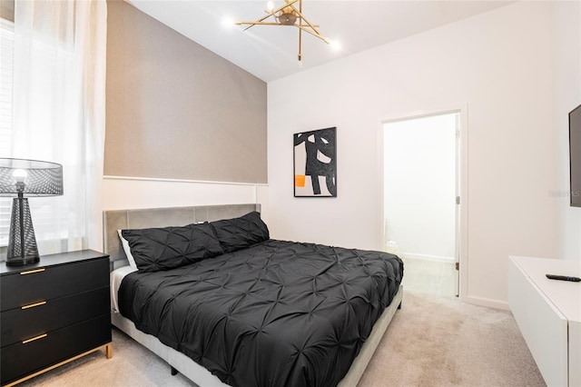 bedroom featuring light carpet, vaulted ceiling, and a notable chandelier