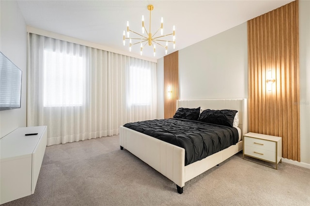 bedroom featuring light carpet and a chandelier