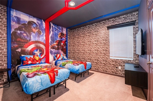 bedroom featuring carpet floors and brick wall