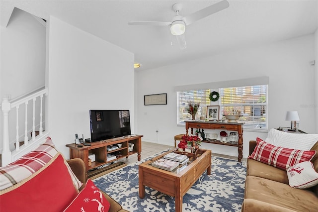 living room featuring tile patterned flooring and ceiling fan